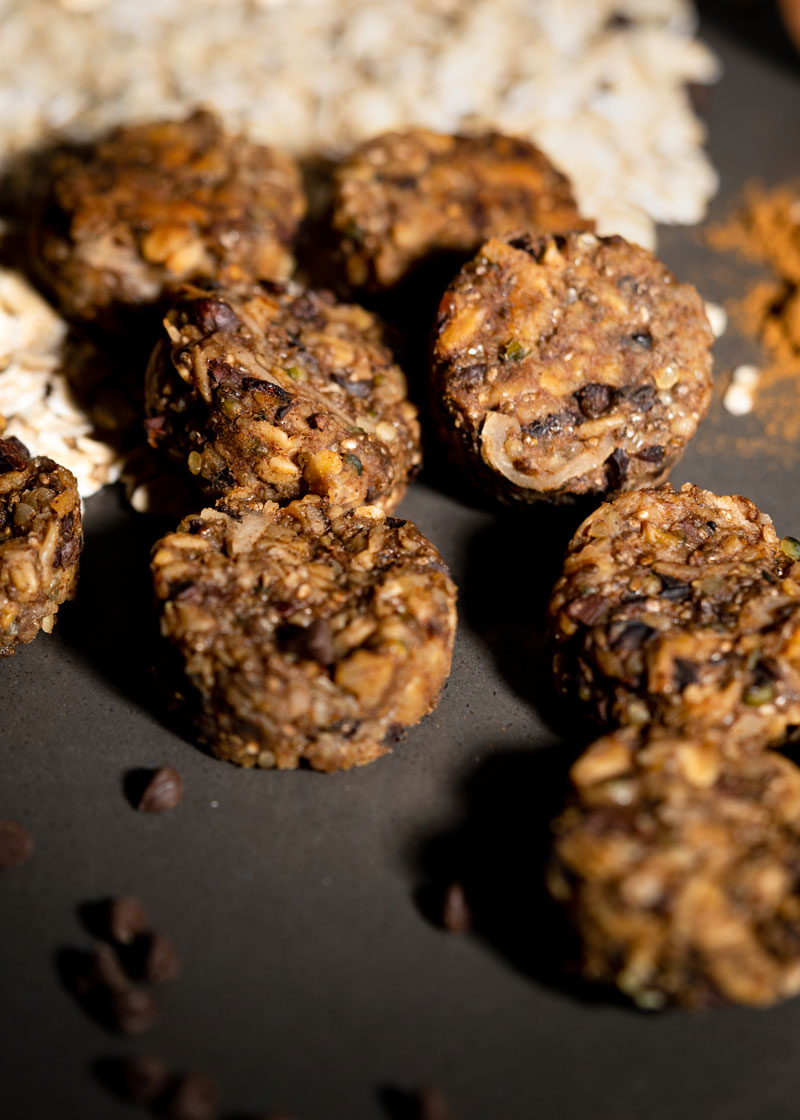 7 energy bites made with oats, cocoa nibs, hemp seeds, chia seeds, and shredded coconut