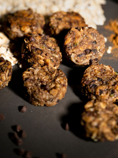 7 energy bites made with oats, cocoa nibs, hemp seeds, chia seeds, and shredded coconut